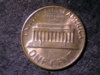 1982 coin 3 words on back very thick.jpg