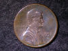 1992 coin 'in god we trust' and 'one cent' flattened.jpg