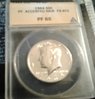 1964 Hair Accent KD Half dollar Hold 1.jpg