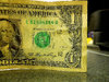 2 Papers on Dollar Bill showing clear Error.JPG