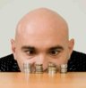 bald-man-staring-at-coins.jpg