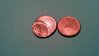 Front of a possible error penny & a blank penny.jpg