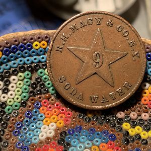 1876 John Matthews Soda Water Token Reverse