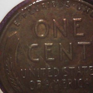 toned steel cent in change back
