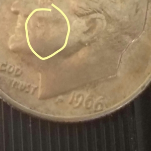 1966 Dime 5 on cheek