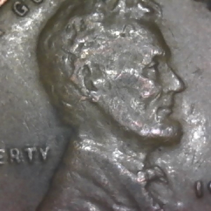 1946 Penny with S on Earlobe