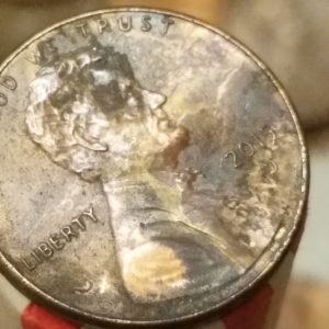 cacked die, lihgtning bolt from Lincolns mouth.