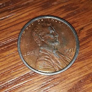1997 d penny on dime planchet (obverse)