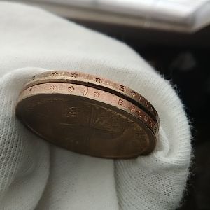 Alignment of  off and bars across edge of bottom coin and doubling stars on top