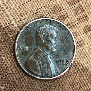1982 penny over canadian coin