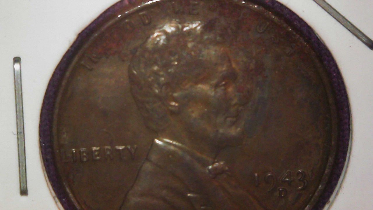 toned steel cent in change front